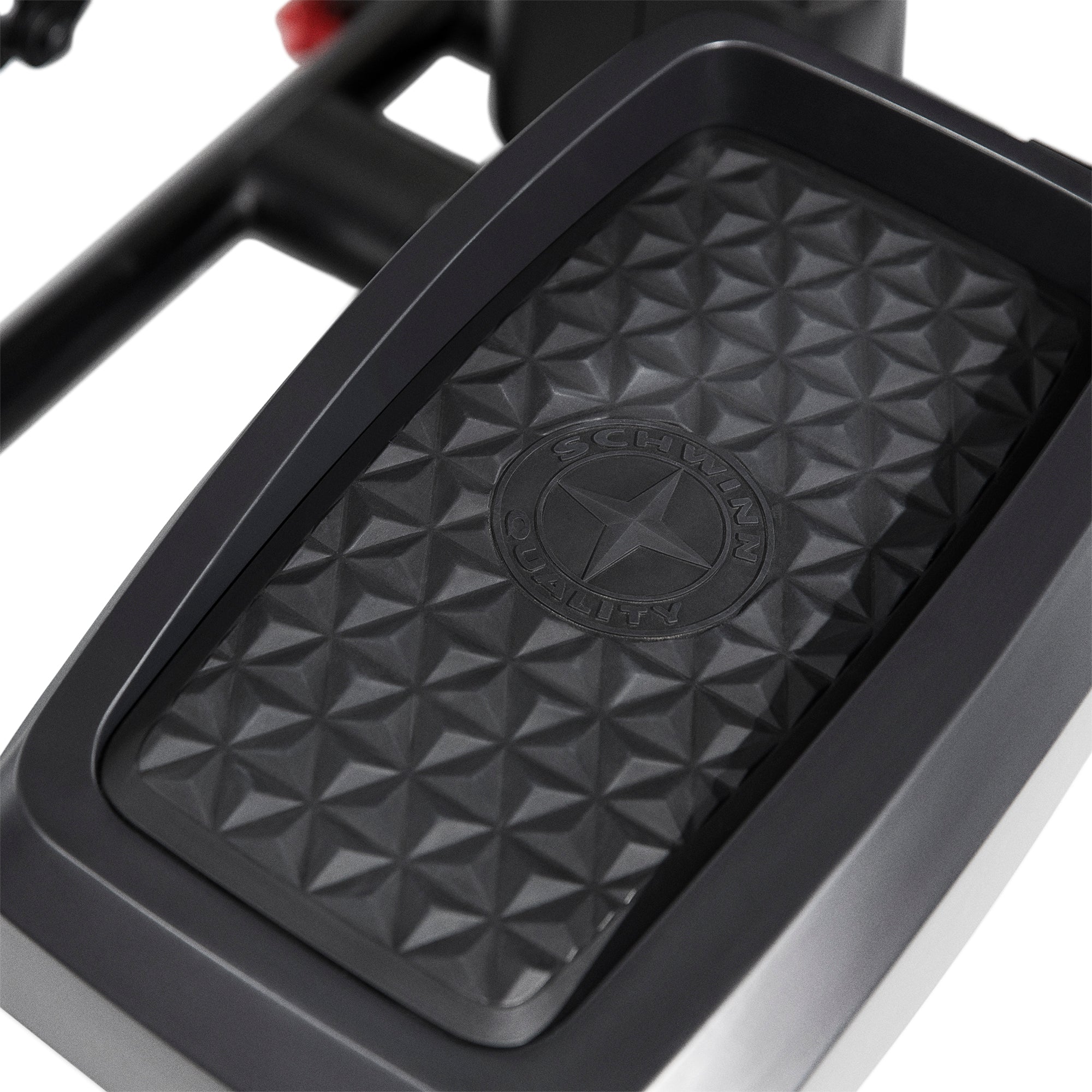 Black textured elliptical pedal with a brand logo on a white background