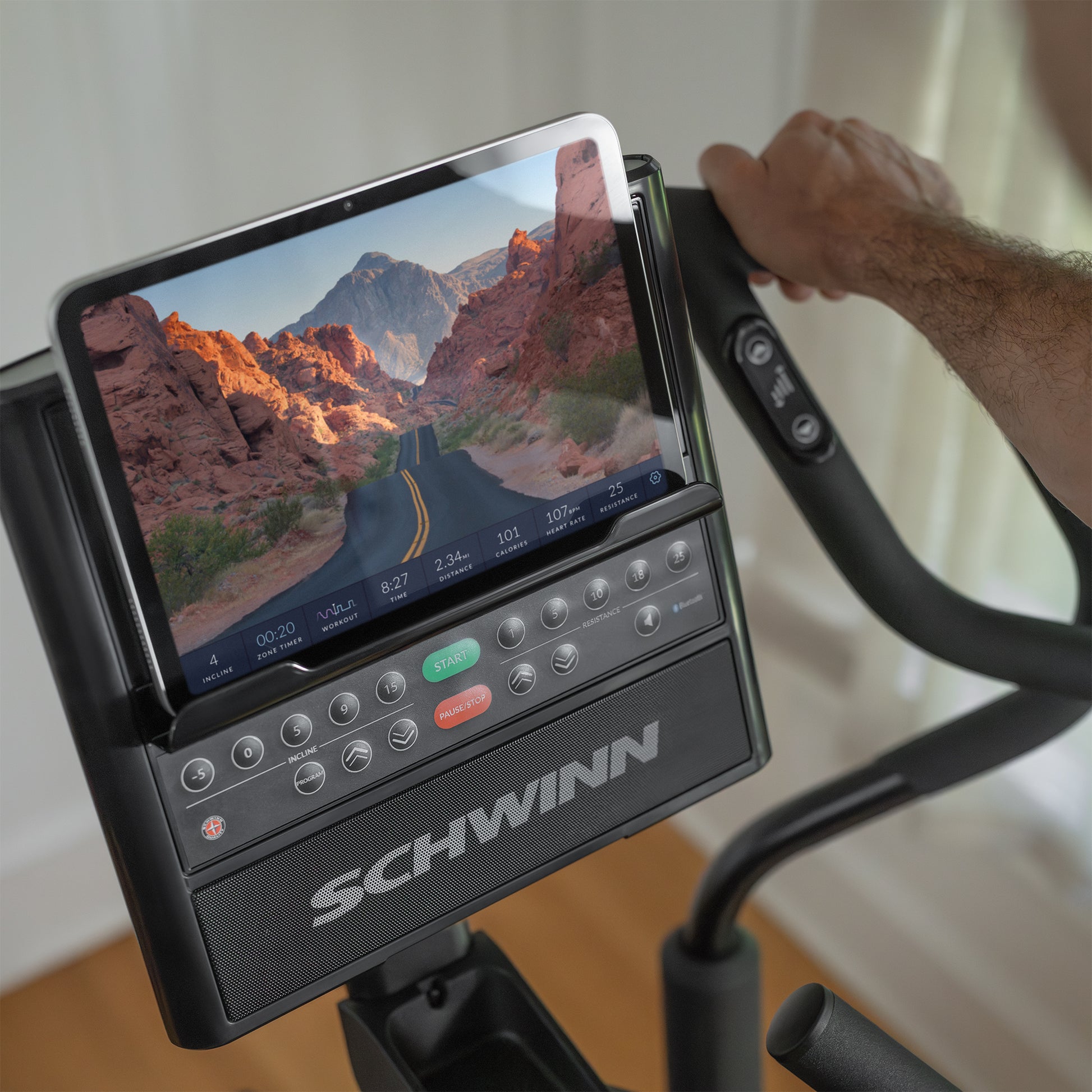 Schwinn elliptical console with tablet displaying a scenic route