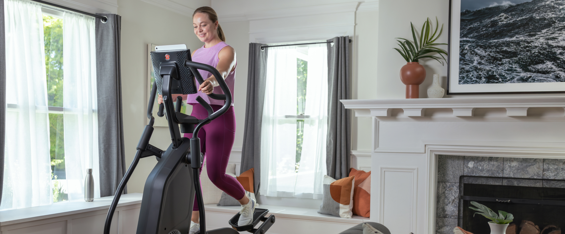 Athletic woman exercising on the NEW Schwinn 490 Elliptical.